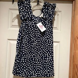 Super cute blue with white polka dots and RUFFLES on the sleeves.